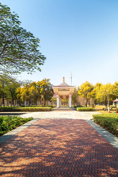 Campus Autumn Scenery: Red Brick Pathway and Ancient Pavilion
