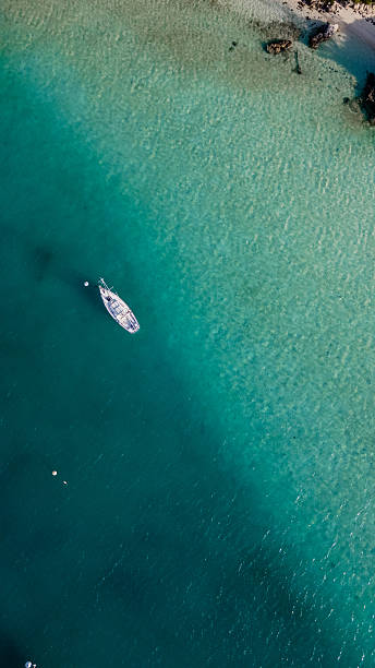 istock Sailboat Floating Near Beach in Bermuda from Above 2227548938