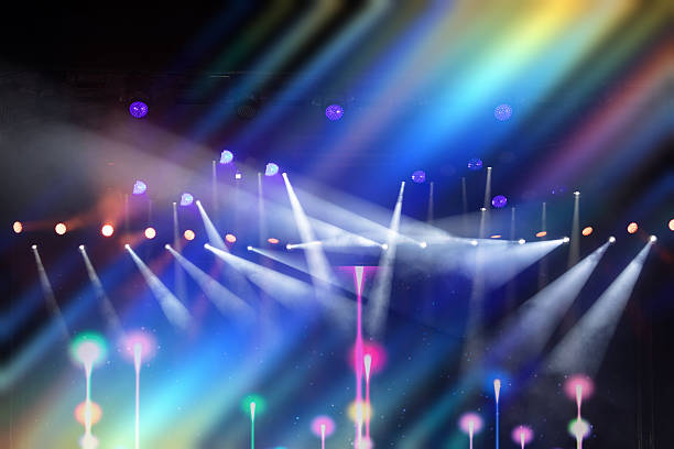 istock Multicolored beams of stage light on a dark blue background. 2227549241