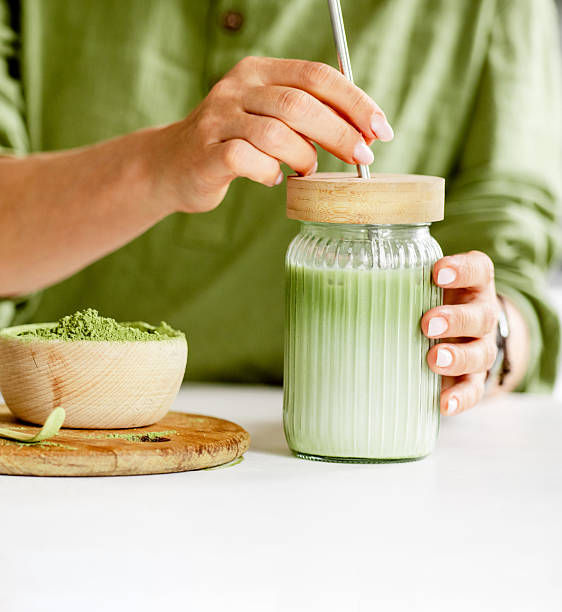 Woman Making Matcha Latte Tea - Close Up Shot