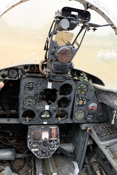 istock Detailed View of an Abandoned Aircraft Cockpit Featuring Worn Instrument Panel and Control Systems in a Rustic Setting Captured on a Cloudy Day with Raindrops on Glass 2227552190