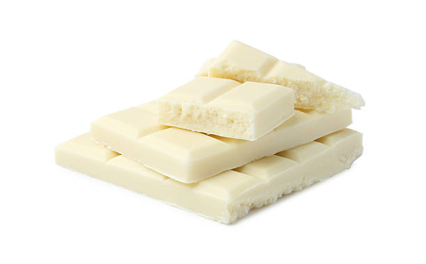 istock Pieces of delicious white chocolate isolated on white 2227552603