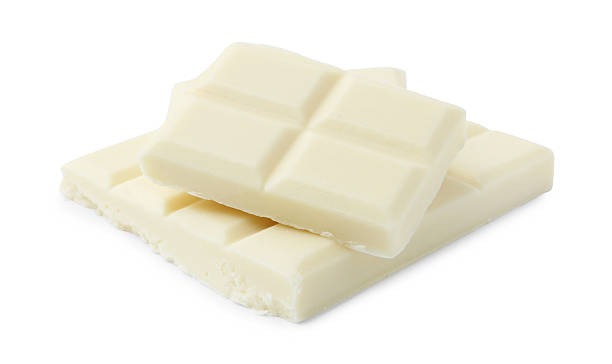 istock Pieces of delicious white chocolate isolated on white 2227552613