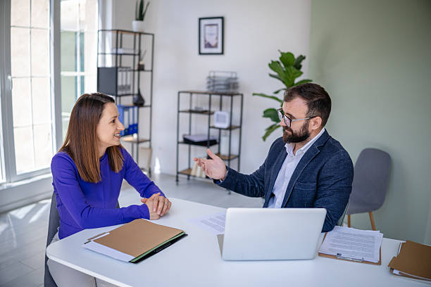 istock Male financial advisor engages in discussion with client in a modern office setting focused on business strategy and financial planning 2227553150