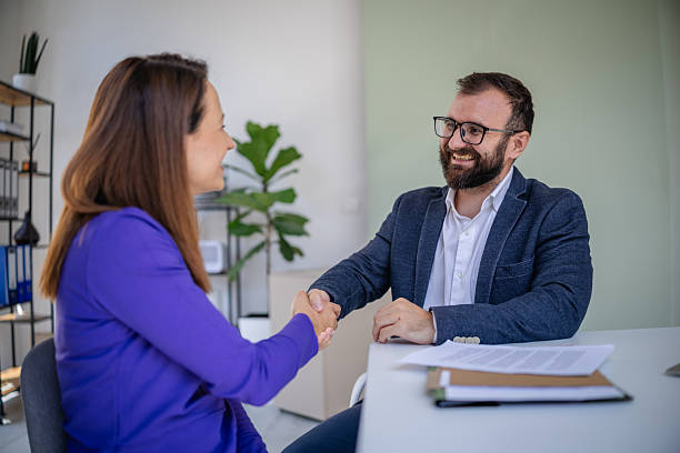 istock Male financial advisor engages in productive meeting with client at modern office discussing business strategies 2227553217