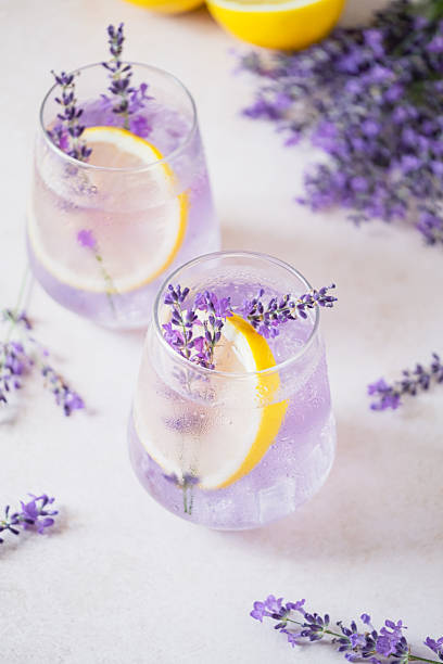istock Refreshing lavender lemonade garnished with lemon slices and lavender sprigs on a marble countertop 2227553458