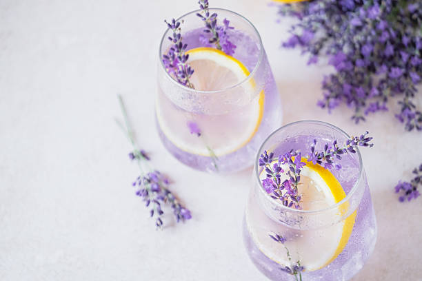 istock Refreshing lavender lemonade garnished with lemon slices and lavender sprigs on a marble countertop 2227553460