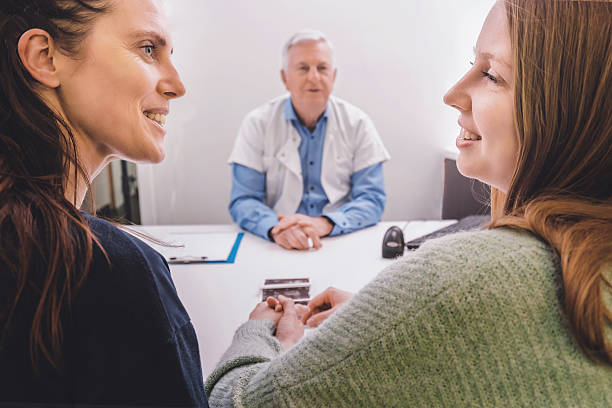 Empowering image of two women sharing a supportive moment at the gynecologist's office, highlighting trust and camaraderie.