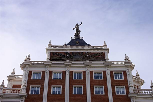 Madrid, Spain – October 20, 2024: Neoclassical sculpture on top of the historic Ocaso Insurance building in Madrid