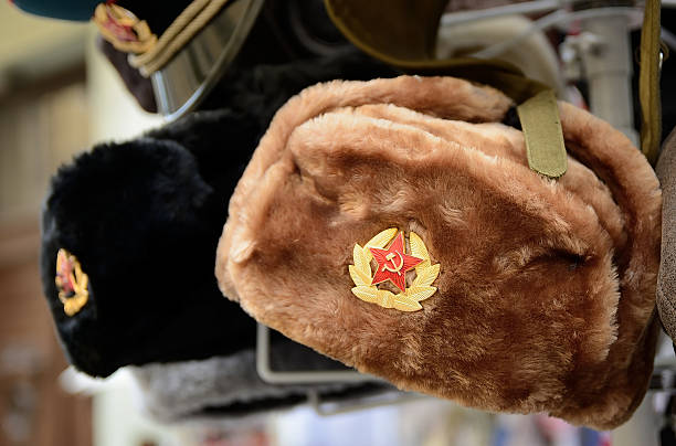 istock Ushanka hats hanging in a souvenir shop displaying soviet symbols 2227556349