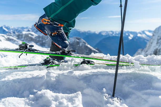 Close up of a pair of skis while skiing at speed.
