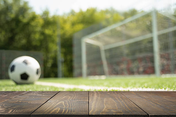 istock Empty soccer goal on field with artificial green grass. Summer outdoor game. 2227558038