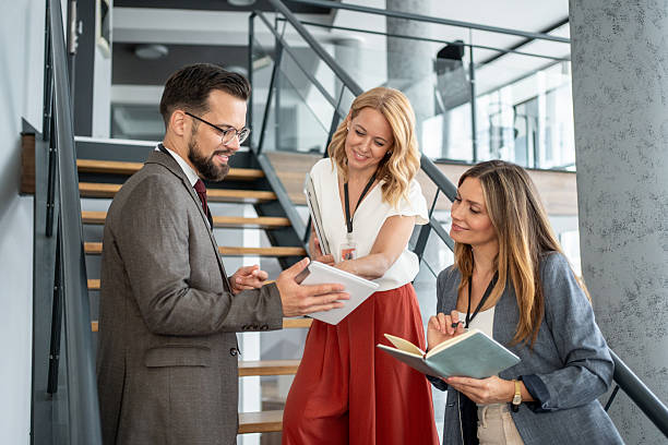 istock Business team discussing work on digital tablet in office 2227560395