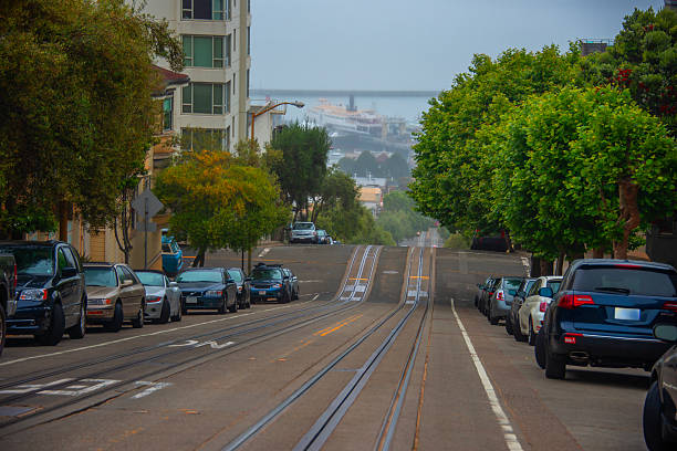 San Francisco, California, USA - April 12, 2024: Cable Car at Hyde Street against cloudy sky