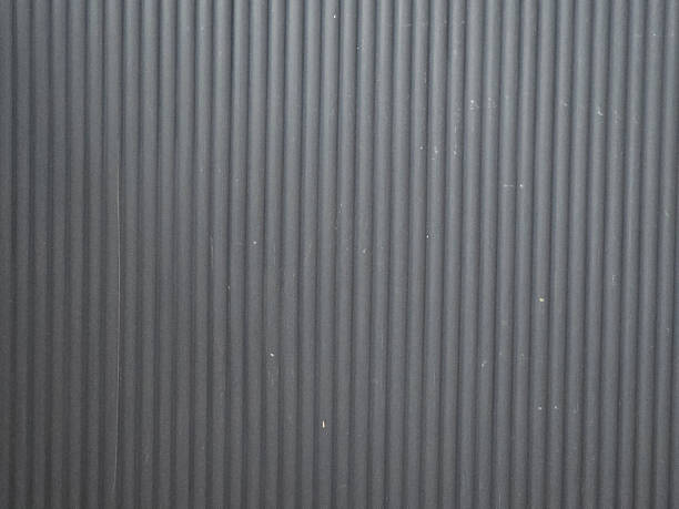 istock textured black surface with vertical grooves, creating modern and sleek appearance. This design can be used in various applications, from backgrounds to product displays 2227561714