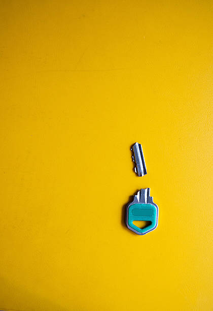 Close inspection of a fractured key, showcasing the wear, stress marks, and break point in sharp detail.