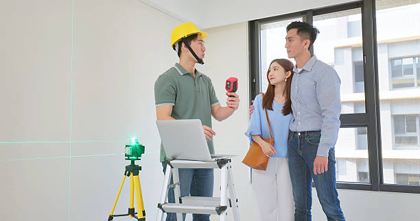 istock home inspector discuss young couple 2227572339