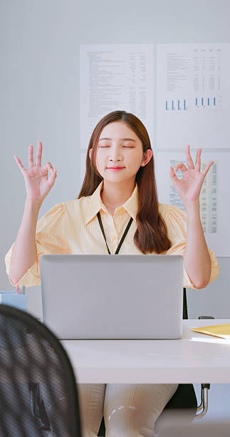 istock businesswoman meditating at office 2227572676
