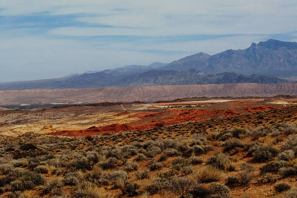 istock View over the multicolored Valley of Fire with distant rugged mountains rising in the background in Nevada, USA. 2227576206