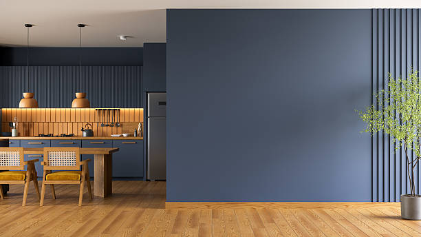 istock Dark blue  wall mockup with  modern kitchen  and dinning table have contemporary chair with  ceiling lamp and wood floor.3d render 2227576737