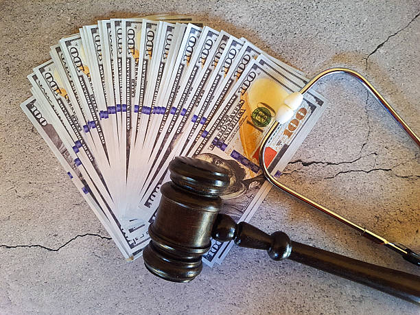 istock Judge's gavel, money and stethoscope 2227579218