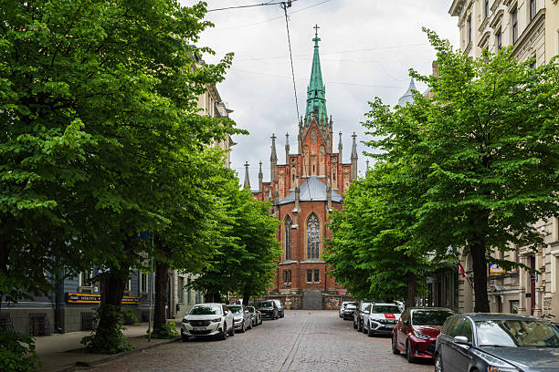 Riga, Latvia - May 31, 2025: Street view at Riga Old St. Gertrude Evangelical Lutheran Church