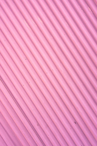 istock Pink corrugated metal wall forming diagonal lines in japan 2227580340