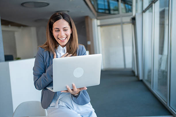 istock Businesswoman laughing while having a video call on laptop 2227582158
