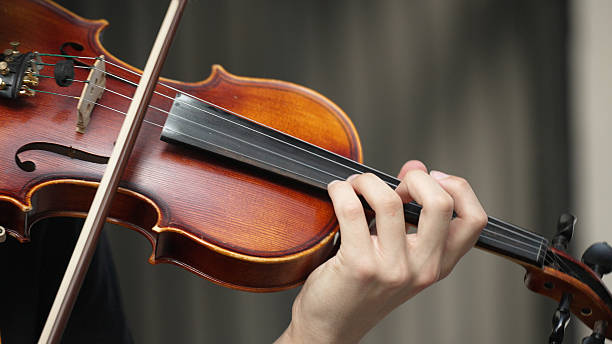 istock Man playing violin on the street. Unrecognizable person. 2227583442
