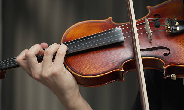 istock Man playing violin on the street. Unrecognizable person. 2227583444
