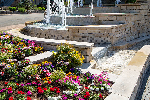 Beautiful flowerbed with flowing water
