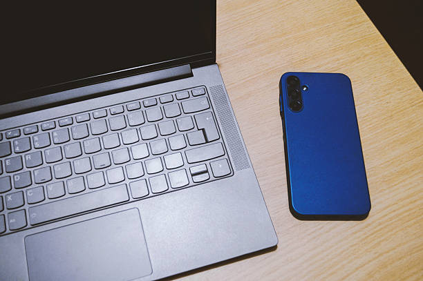 istock Laptop and celular phone 2227587661