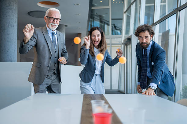 istock Business team playing beer pong in the office during break time 2227589053