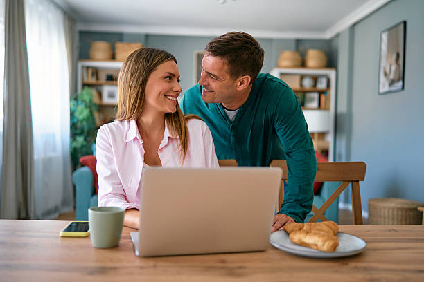 istock Young Couple Sharing a Moment While Working From Home 2227594797