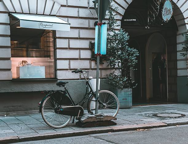 Munich, Germany – July 17, 2025: A bicycle parked on a street in front of a store