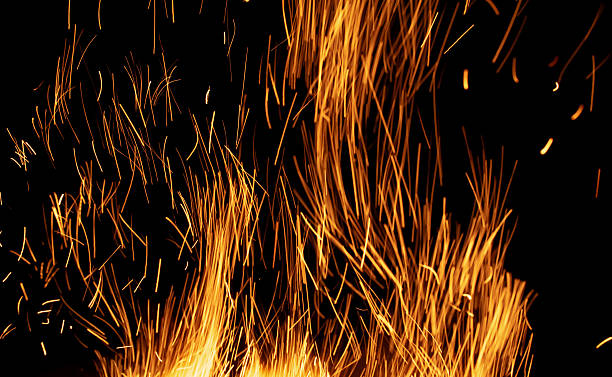 istock sparks from the fire glowing in the dark 2227600087