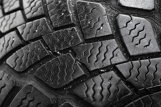 istock tire tread, tire traces background 2227600115