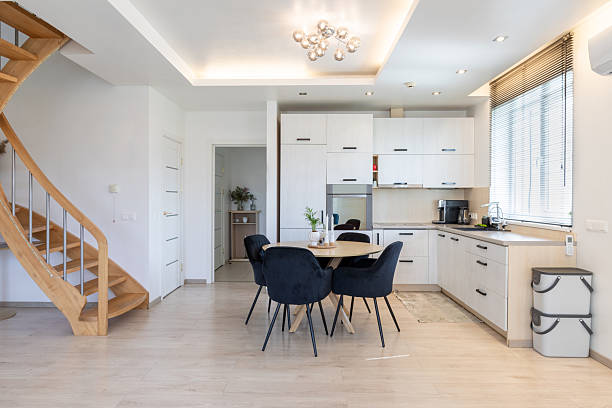 istock Contemporary Kitchen Interior with Wooden Staircase and Stylish Dining Area 2227601414