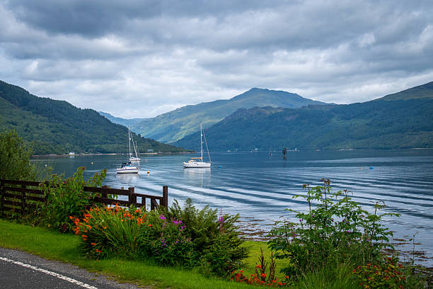 Calm water of loch Goil in Argyll and Bute council, Scottish Highlands on a cloudy summer day