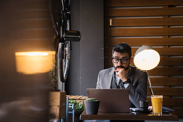 istock Remote worker in eyeglasses on video call in cafe 2227603709