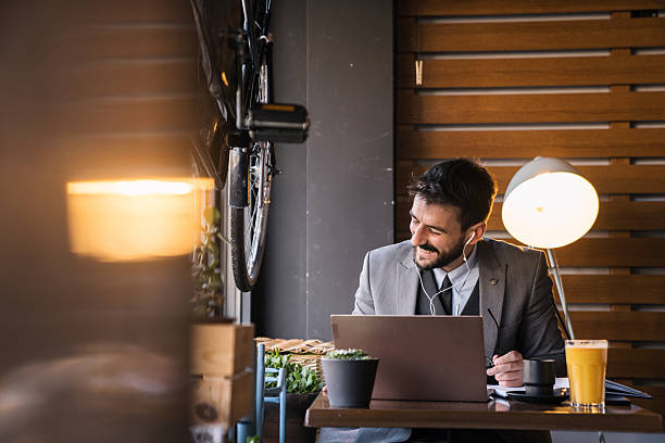 istock Freelancer laughing during casual video chat in cafe 2227603755