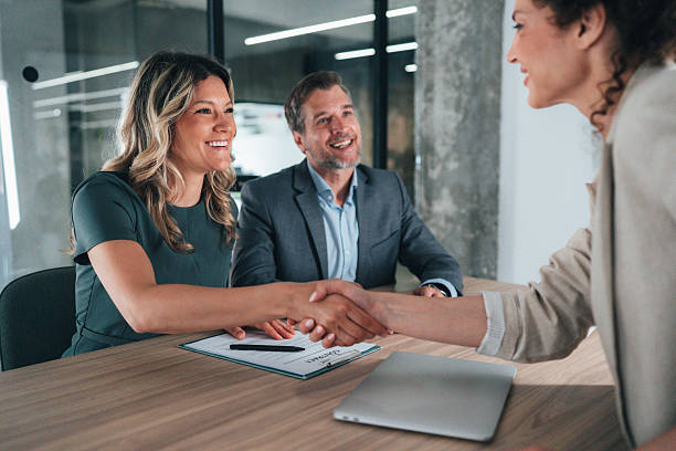 istock Meeting success. Business partners shaking hands 2227605959