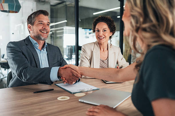 istock Meeting success. Business partners shaking hands 2227605970