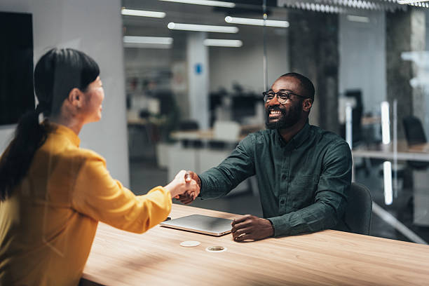 istock Meeting success. Business partners shaking hands 2227605975