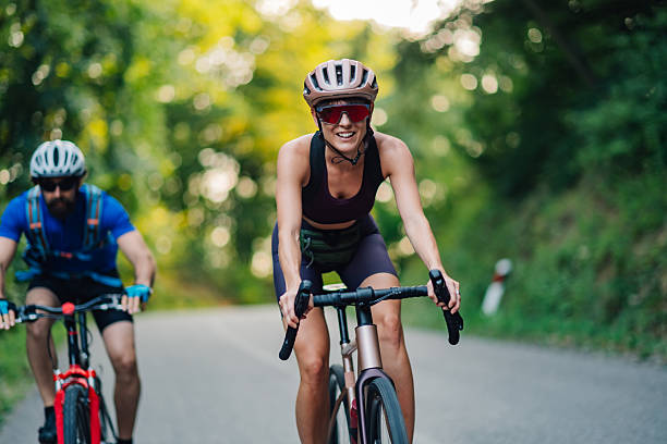 istock Smiling cyclist leading the pack on a country road 2227606630