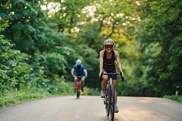 istock Cyclists enjoying a ride on a forest road 2227606638