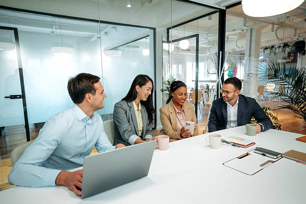 istock Colleagues having team meeting in boardroom discussing ideas 2227607185