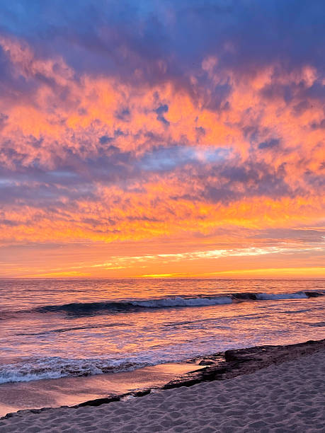 istock Orange sunset with beach and clouds in Mexico 2227609556