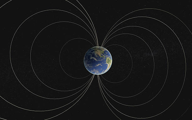 istock Earth appears encased in sweeping magnetic field lines that arc from pole to pole, forming protective loops. 2227610109