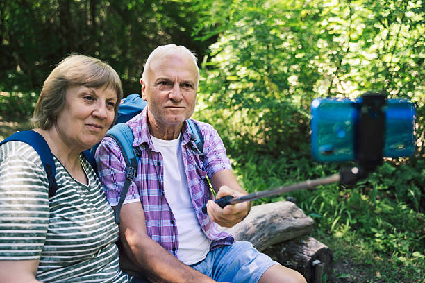 istock Couple Taking a Selfie in Nature Together 2227610250